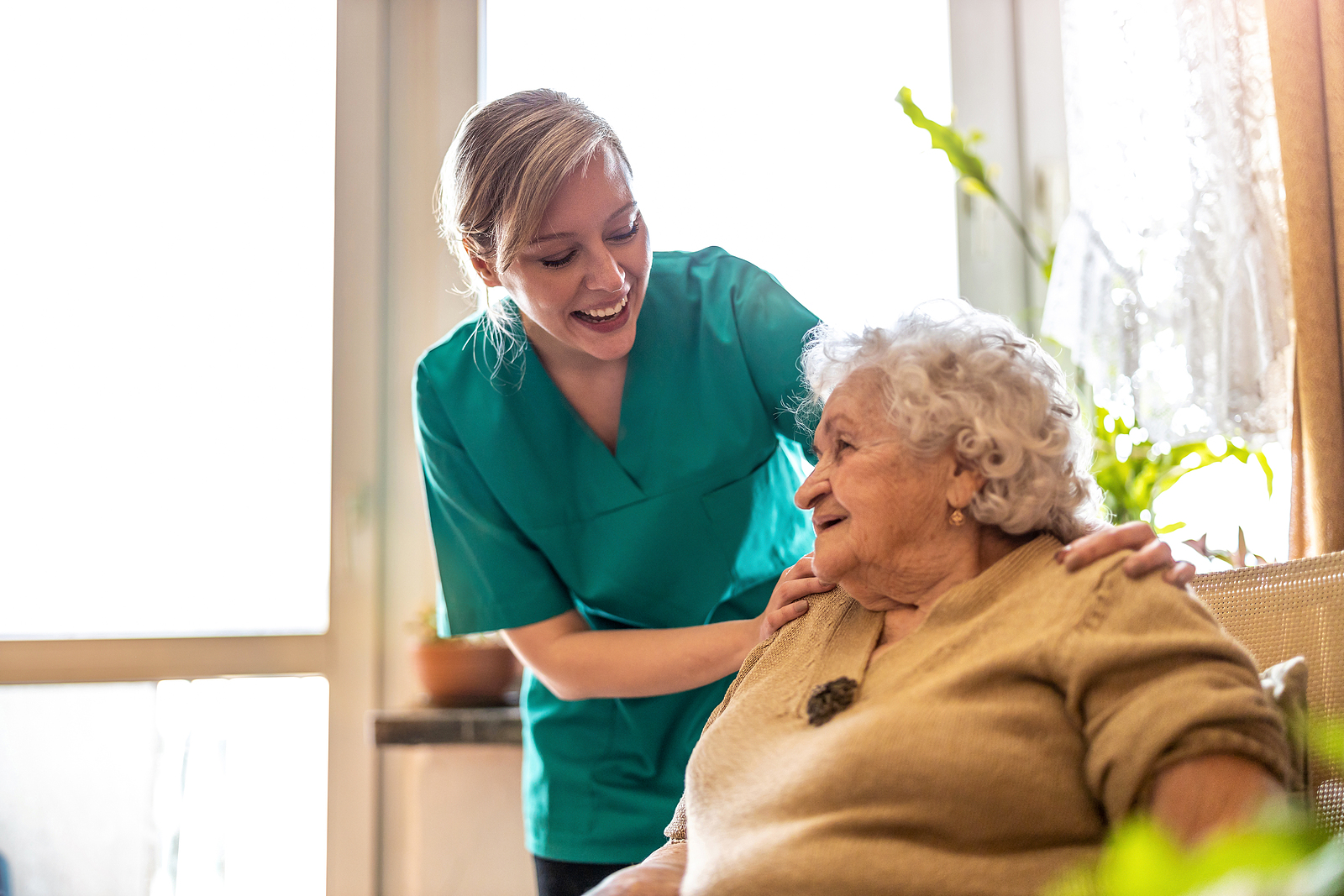 bigstock Friendly nurse supporting an e 412941106