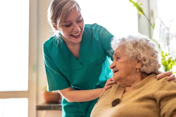 bigstock Friendly nurse supporting an e 412941106