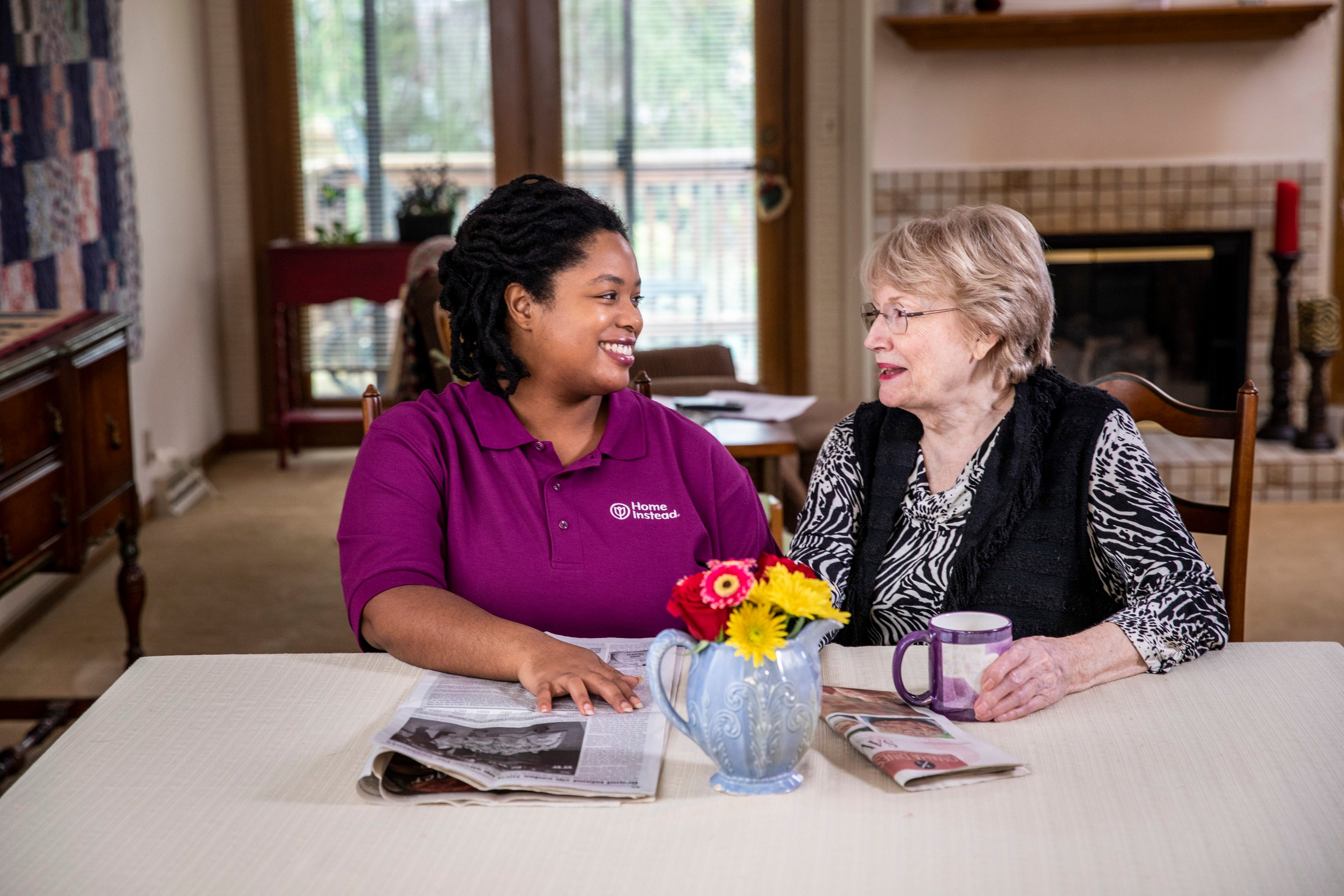 caregiver talking to elderly women