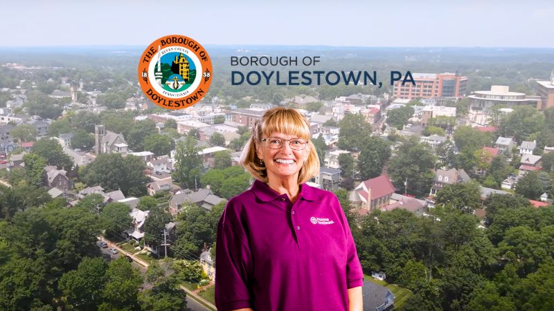 Home Instead caregiver with Doylestown, PA in the background