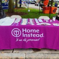 home instead booth at town down event