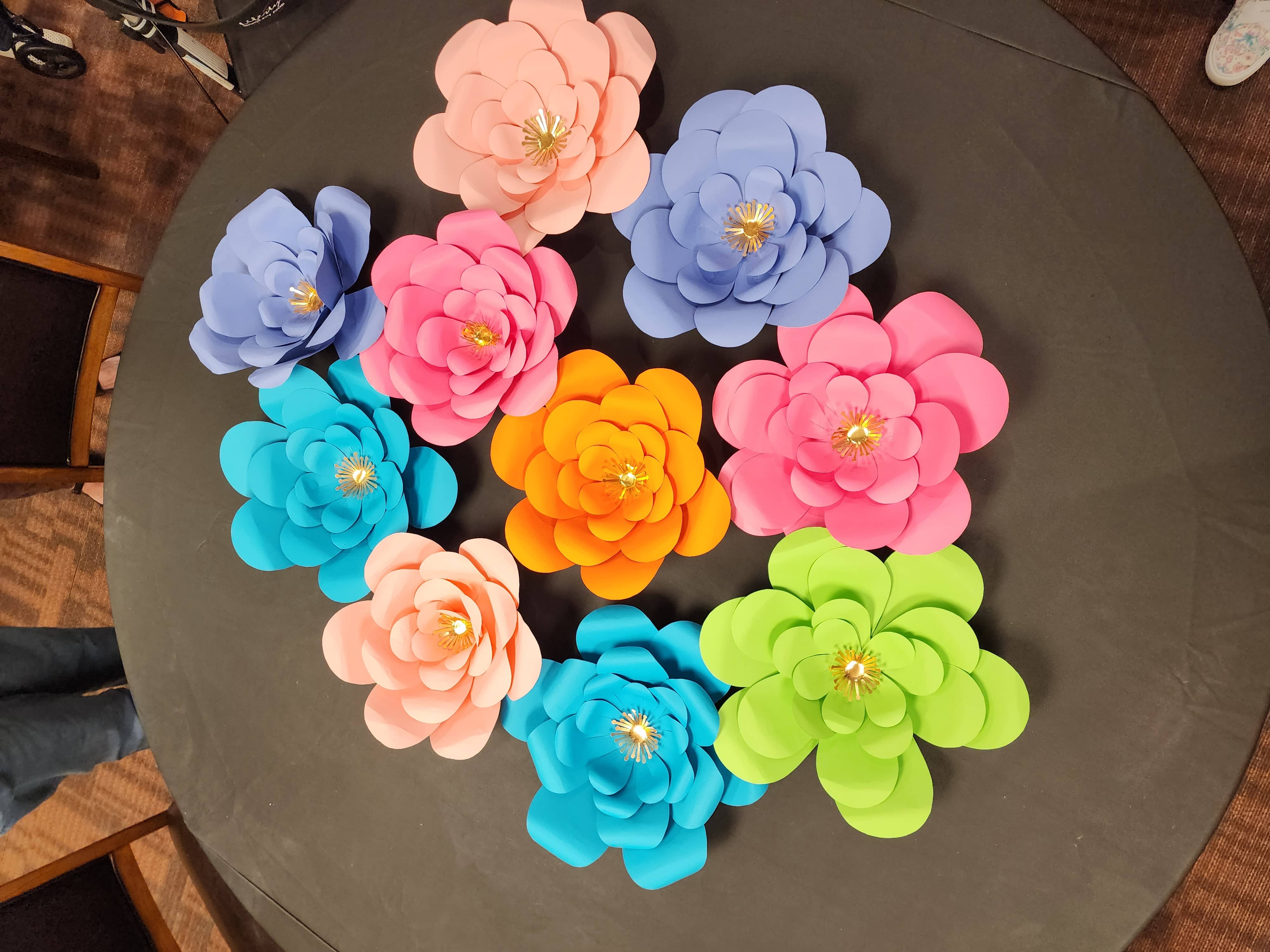 Photo of the paper wall flowers made by the residents of with the home instead team