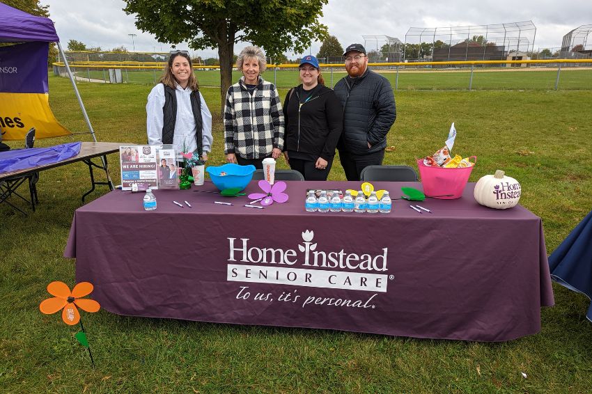 home instead team at walk to end alzheimers booth