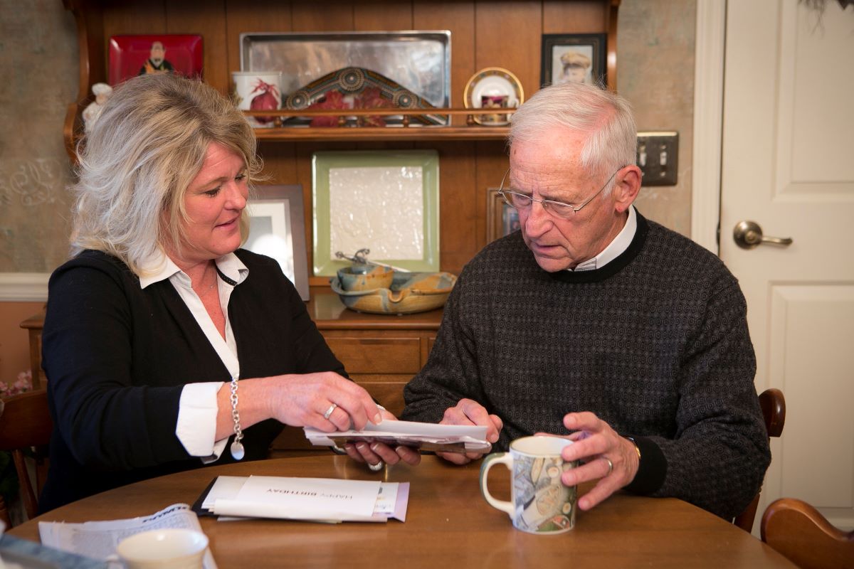 kathy and dad looking at mail 1 