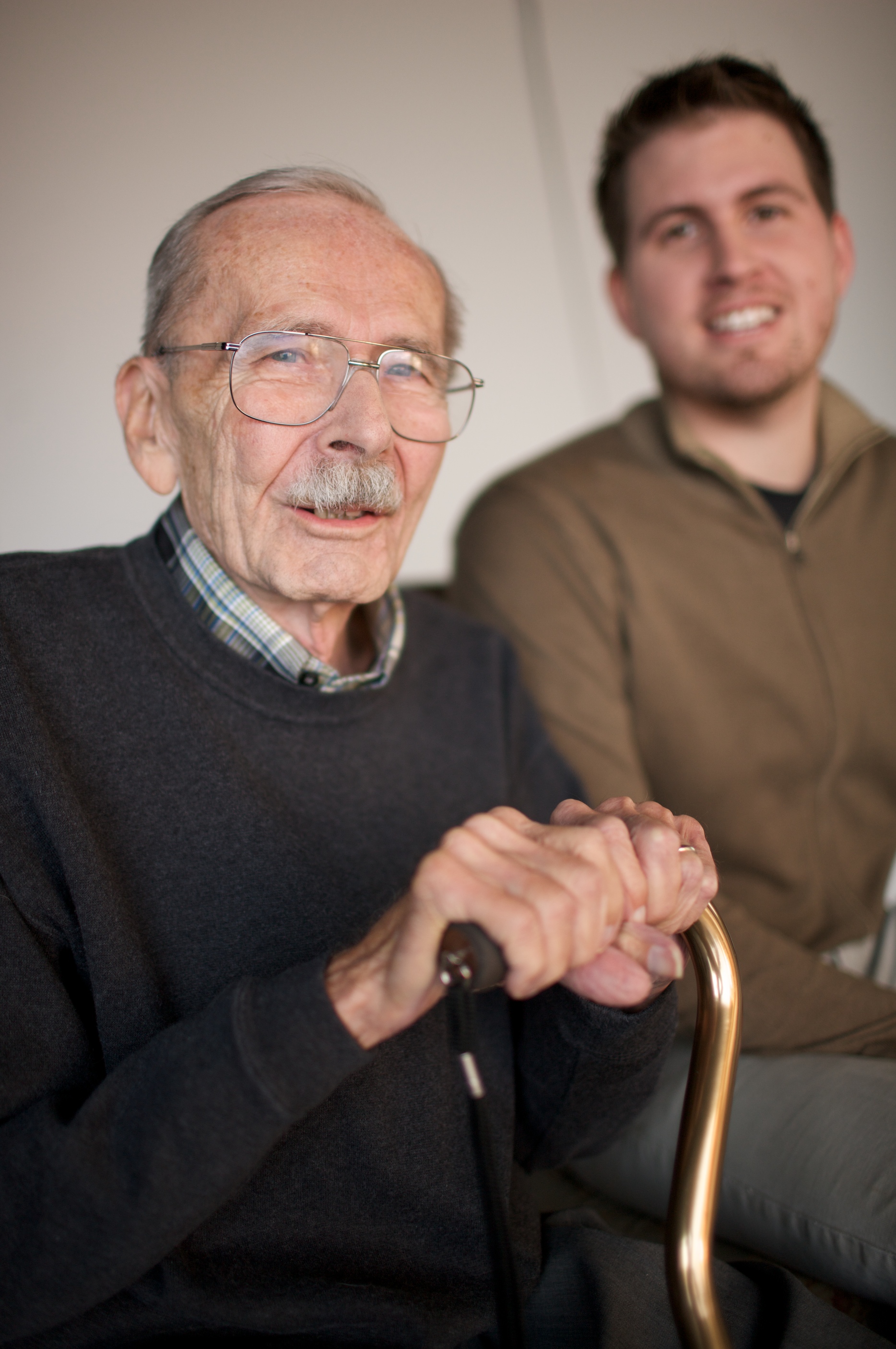 Senior man with cane caregiver