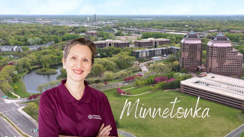 home instead caregiver standing in front of minnetonka, mn